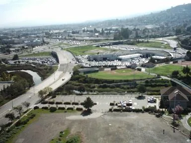 Aerial photo over a park and parking lot