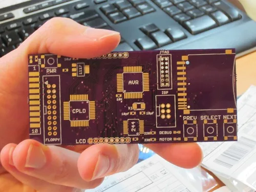 Bare Floppy Emu PCB in a hand