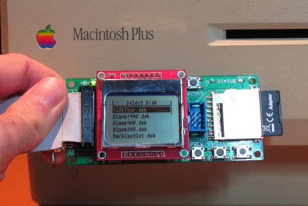 Floppy Emu in front of a Mac Plus