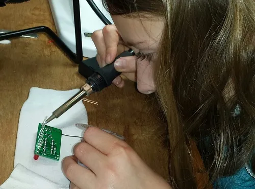 Alice soldering the Blinky POV kit