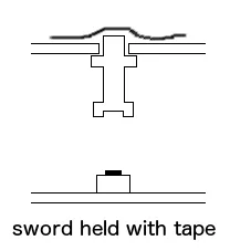 Button sword held in place with tape