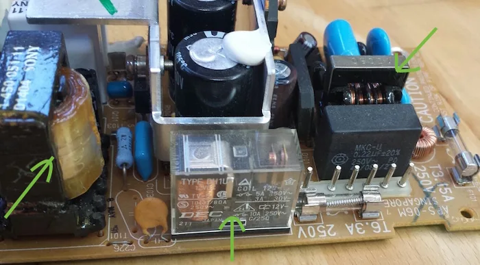 Power supply components marked with arrows