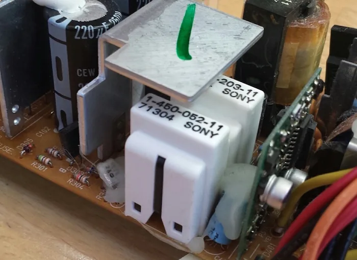 White plastic covers on the power supply board
