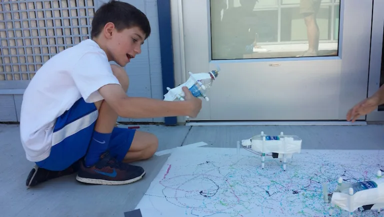 Kid with his scribbling machine