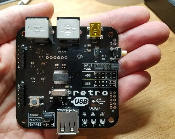 Retro USB board in a hand