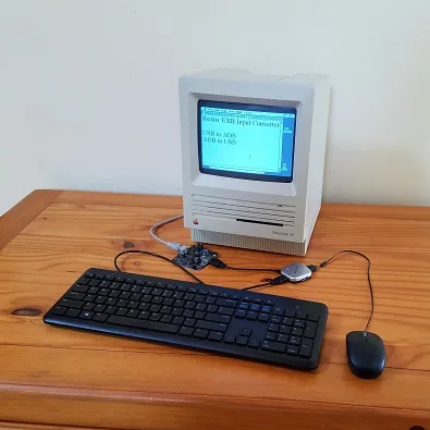 USB keyboard and mouse connected to a Macintosh SE through a Wombat