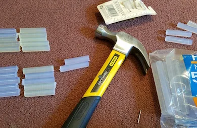 Hot glue sticks and a hammer