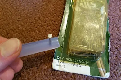 Glue stick piece on a nail