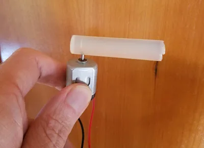 Glue stick attached to the motor shaft