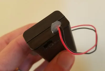Battery holder with a switch