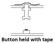 Button held with tape during assembly