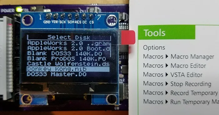 OLED display next to a quick reference card