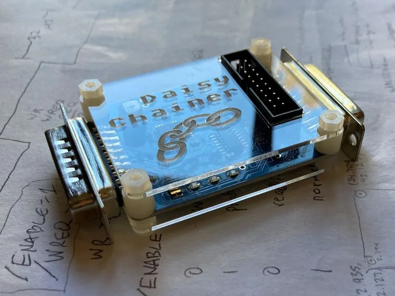 Daisy Chainer in its acrylic case